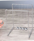 Must Have Pendulum Frame Physics Desk Toy For Learning And Decor, Cradle Style Science Education Gadget in silver metal