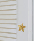 Brushed Brass Five-Leaf Flower Cabinet Knob And Dresser Pull For Wardrobe Drawers on white shutter