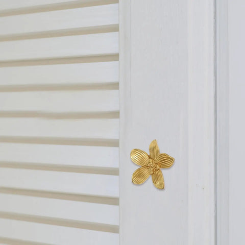 Brushed Brass Five-Leaf Flower Cabinet Knob And Dresser Pull For Wardrobe Drawers on white shutter