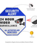 2 Pack Outdoor Security Camera Signs For Home Or Biz, Video Surveillance Signage Featuring UV Printed 40 Mil Aluminum, 10x10 Inches, Weatherproof And Rust Free, Heavy Duty Metal Signage, octagonal shape with text and camera graphic displayed.