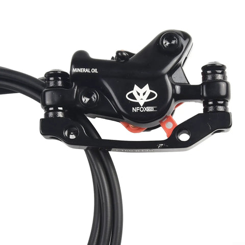 Heavy Duty Hydraulic Disc Brake Kit For Electric Kick Scooters Featuring Twin Front Rear Rotors Dual Calipers Master Levers Plus Two Pin Sm Connector close-up of black hydraulic caliper with mineral oil.