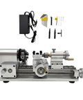Straight Shooting Compact Mini Lathe Machine Featuring Variable Speed DC Motor Turning Wood Aluminum And Plastics, showing toolset and power supply.