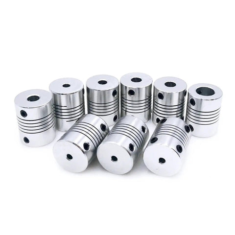 Knockout D19L25 Flexible Encoder Coupler With Plug And Play Setup For Stepper Motors And Cnc Engravers Built Like A Tank For Zero Slack In 6Mm To 8Mm Bores Top Rated For 3D Printers, shown in a group of ten metallic couplers.