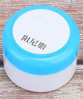 Container of White Damping Grease Paste, 1.9 Oz, Mechanical Lubricant For Rubber O Rings And Bearings, blue lid on wooden surface.