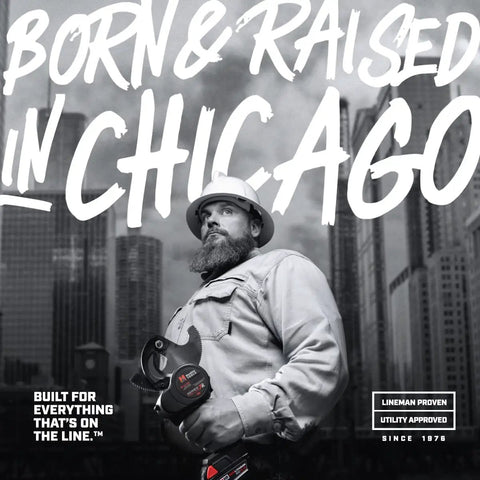 Worker holding a Manual Hydraulic Cutter For ACSR Copper Aluminum Up To 50mm Capacity in front of Chicago skyline.