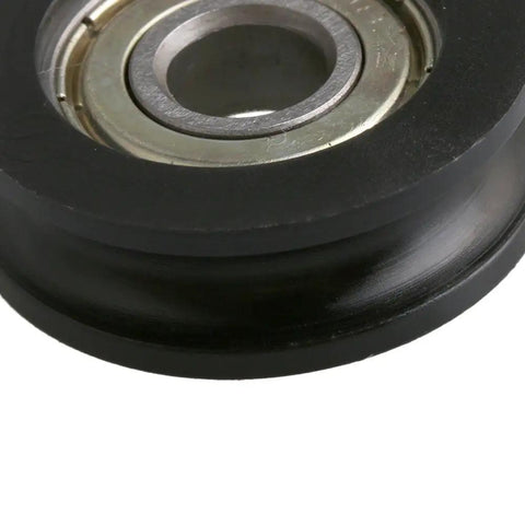 Four Piece U Type Black Pulley Wheel Set With 8mm Shaft Hole And 30mm Diameter For Smooth Rolling Rails Heavy Duty Replacement Roller Bearing Max Load 99kg Ideal For DIY Projects Equipment Upgrades And Garage Setups, black U-type pulley wheel close-up