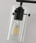 Close-up of the Three Light Matte Black Vanity Light With Clear Glass Shades For Bathroom Mirror Over Vanity And Beyond Perfect Wall Sconce