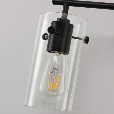 Close-up of the Three Light Matte Black Vanity Light With Clear Glass Shades For Bathroom Mirror Over Vanity And Beyond Perfect Wall Sconce