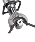 Close-up of a Heavy Duty Portable Electric Rebar Cutter gripping rebar, showcasing its precision and robust design for steel bending.