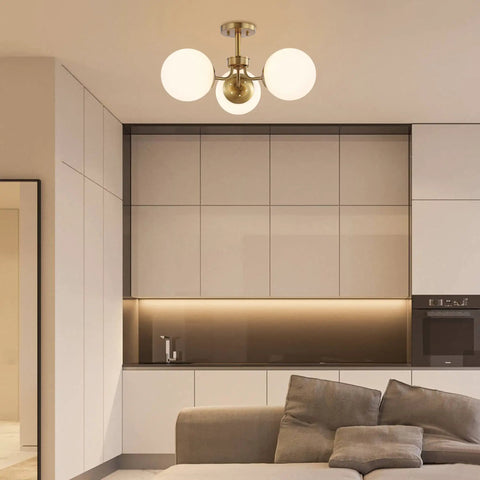 Brass Gold 3-Light Dope Mid Century Modern Semi Flush Mount Light With Frosted White Glass Globe Shade in modern kitchen
