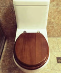 Universal Soft Close Toilet Seat Crafted From Real Solid Wood With Authentic Bark Veneer on a white toilet in a modern bath.