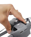Close-up of Grab And Go Handheld Drone Mount for DJI Mini series in use, showing secure grip and attachment details.