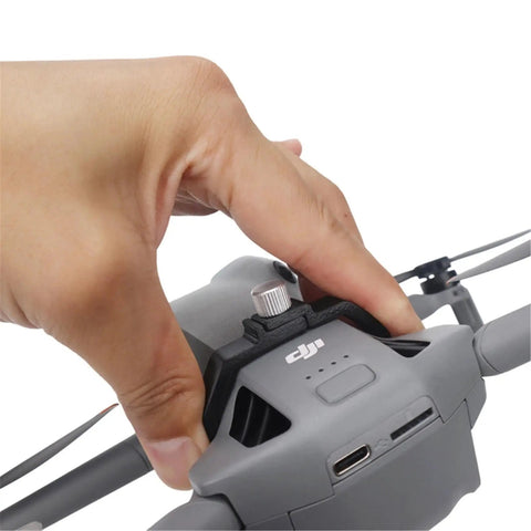 Close-up of Grab And Go Handheld Drone Mount for DJI Mini series in use, showing secure grip and attachment details.