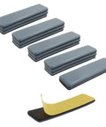 1x4 Inch Rectangular Adhesive Furniture Sliders With PTFE Glides 16 Pack shown in stacked angle view, yellow peel-off backing visible.