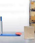 Industrial Workhorse Stretch Film Dispenser, Snappy Manual Wrap Roller with blue frame near wrapped pallet box