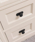 Matte Black Cabinet Knobs With Scalloped Backplates 6 Pack Featuring Slick Fluted Floral Handles And A Beaded Center Medallion on cream cabinet drawers.