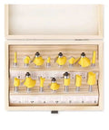 Top Tier 15 Pc Router Bit Set With 8mm Shank Carbide Cutting Edges For Precision Wood Trimming in a wooden case.