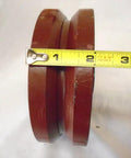 Heavy Duty Kingpinless Swivel Caster With Reliable Parking Brake And 7/8 Inch V Groove Ductile Steel Wheel side view showing diameter with measuring tape.