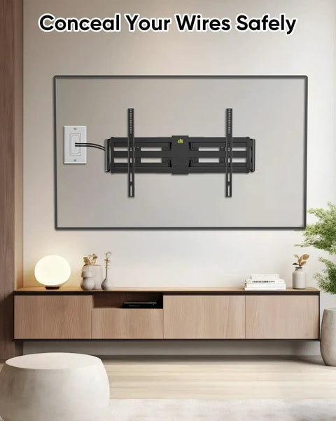 Slick Flexible Rubber Wall Grommet Kit For Hassle Free Low Voltage Cable Routing Behind TV And Game Console Smooth Install No Drama Neat Media Setup Two Piece Off White, installed behind a TV for wire concealment.