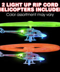Light Up Flying Helicopters Set Of 2 With LED Lights And Handheld Launcher, showcasing green and orange LED blades.