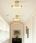 Dope Brushed Nickel Three Light Semi Flush Mount Ceiling Light With White Glass Bowl Shade in modern hallway setting