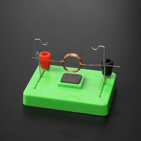 Electric Motor Model And Electromagnetic Swing Kit For Classroom Learning on green base with copper coil highlighting electromagnetism.