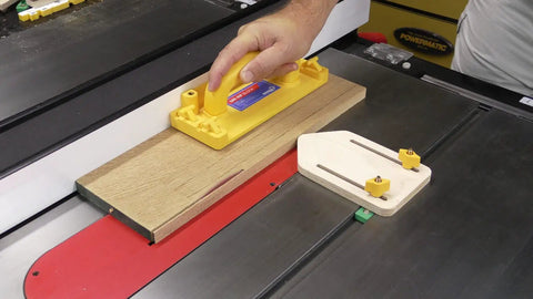 Bulletproof Zero Play Miter Stop Fence With Quick T Track Lock positioned on a table saw for precise wood cutting.
