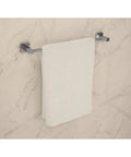 Duro 4 Piece Wall Mounted Bathroom Hardware Set In Polished Chrome Includes 18 Inch Towel Bar Towel hanging on marble wall