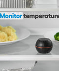 HT Black WiFi Temperature And Humidity Sensor monitoring food temperature in refrigerator shelf