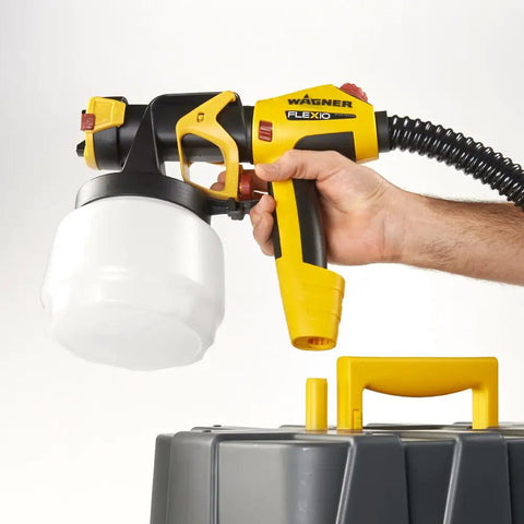 FlexiO 890 HVLP Paint Sprayer Shoots Unthinned Latex Smooth As Butter With Dual Nozzles, handheld view with cup.
