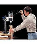 User operating the Badass Built Rock Solid Three Quarter Horsepower Heavy Duty Benchtop Mortising Machine on wood.