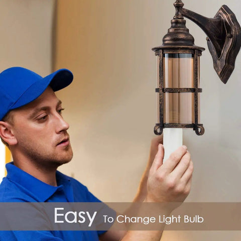 Person installing Outdoor Wall Lanterns 2 Pack Industrial Rustic Porch Light Golden Bronze Exterior Wall Sconces With Amber Glass Shade