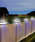 Solar Post Cap Lights Outdoor No Wiring Deck Lighting 52 LED 160 Lumen illuminating fence at night