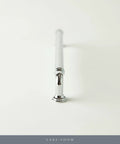 Chrome cabinet pull handle on white background, view from end.