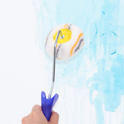 Heavy Duty Double Head Paint Roller Brush For Knocking Out Corners And Crisp Wall Edges Featuring An Ergonomic Handle in action on blue wall.