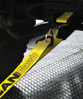 Beefy Heavy Duty Axle Tie Down Combo Strap with Snap Hook Ratchet, 2 Inch by 114 Inch, securing vehicle axle, classic yellow.