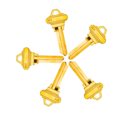 Brass Finish Uncut Key Blanks SC4 6SH1 displayed in a fan pattern, durable for locksmiths and DIY, pack of 50