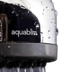 Close-up of TurboSpa 3 Inch High Pressure Shower Head with 42 Nozzles, ultra wide spray visible, focus on metal finish and water droplets.