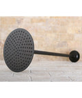 Shower Scape 7-3/4-Inch Round Brass Rain Shower Head With 17-Inch Ceiling Mount Arm In Polished Nickel, side view on stone