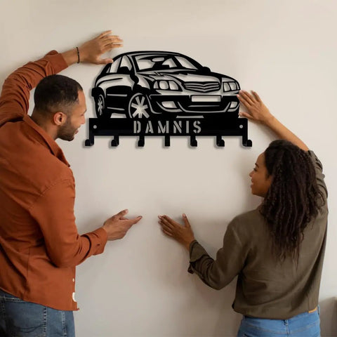 Couple installing Custom Name Car Key Wall Mount Organizer Rack For Car Lovers in living room