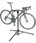 Pro Level Bike Repair Stand With Built In Digital Scale holding a bike, showing 360 rotating clamp and durable tripod design