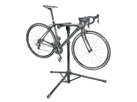 Pro Level Bike Repair Stand With Built In Digital Scale holding a bike, showing 360 rotating clamp and durable tripod design