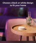 Wall Tap Dial Dimmer Switch For Smart Lights White 1 Pack Easy Wireless Setup on a round wooden table near a sofa
