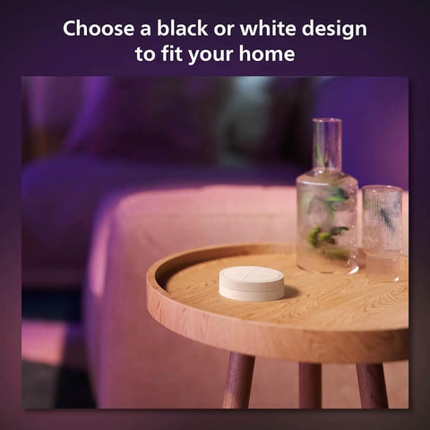 Wall Tap Dial Dimmer Switch For Smart Lights White 1 Pack Easy Wireless Setup on a round wooden table near a sofa
