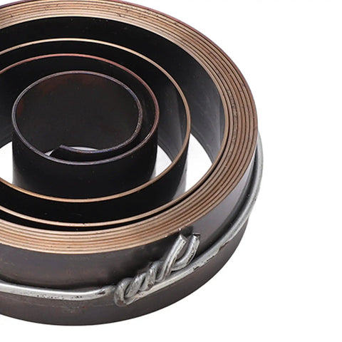 Fast Return Drill Press Quill Spring Coil in Chrome Plated Spring Steel, 19mm wide, 64mm outer diameter, close-up of coil