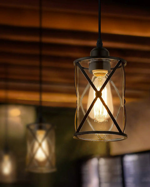 Black Glass Pendant Lights Two Pack With Clear Glass Cylinders, Industrial Farmhouse Cage Hanging Lights in dim room