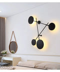 Top Shelf Round Led Wall Sconce Lighting For Bedroom Bedside Decor Featuring Smooth 360 Degree Rotation Matte Black Iron Industrial Loft Fixture Serving Clean Soft Glow showcasing modern design with round lights on wall.