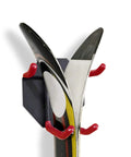 Heavy Duty Wall Mounted Ski Rack And Pole Hanger Featuring Rock Solid Padded Hooks securing skis with red padded hooks on black mount.