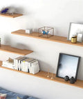 Floating wooden shelves supported by heavy duty hidden shelf bracket for wall mounts, showing adjustable use for home storage.