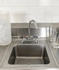 Heavy Duty Commercial Gooseneck Faucet Deck Mount Two Handle Solid Brass Build Chrome Finish Rust Resistant Kitchen Bath Sink Fixture Built Different For The Long Haul with clean stainless sink and glasses.